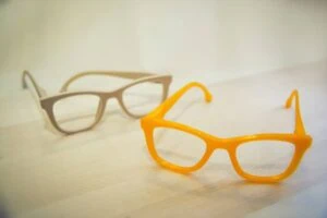3D printed yellow and beige glasses frame