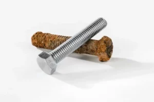 Comparison of a rusted nail and a nail protected against corrosion