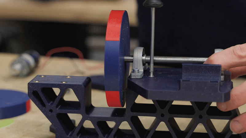 Aligning the magnet disks during assembly — alternating poles create the magnetic link.©