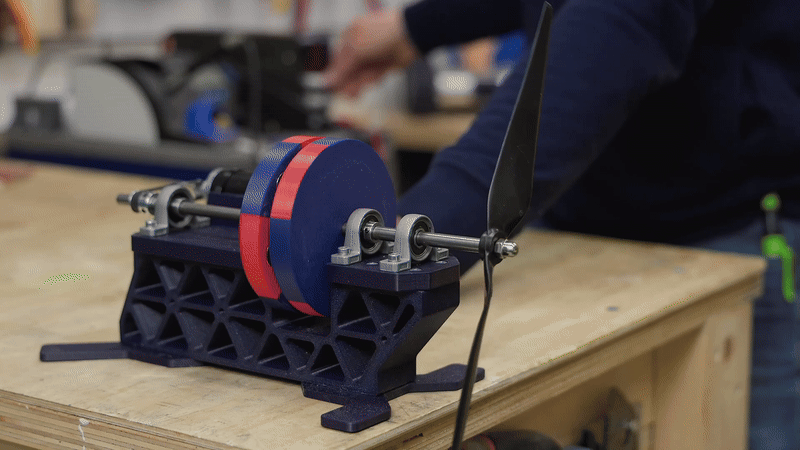 Assembling the magnetic coupler — magnets face each other in alternating polarity.©