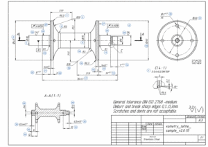 Close-up example of a typical engineering drawing depicting orthographic views, dimensions, tolerances, and various technical specifications.