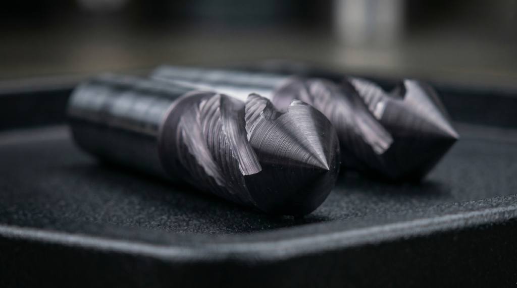 90-degree included angle chamfer mill with dark nitride coating showing conical cutting geometry.