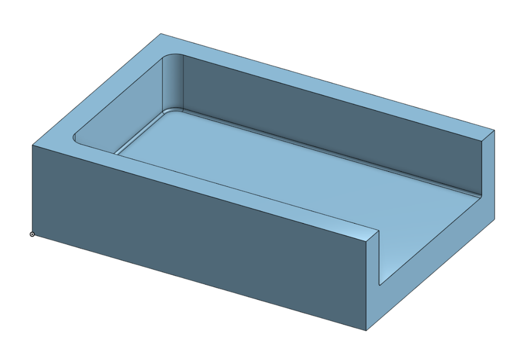 Open pocket in a block with one wall missing, allowing side entry and chip clearance.